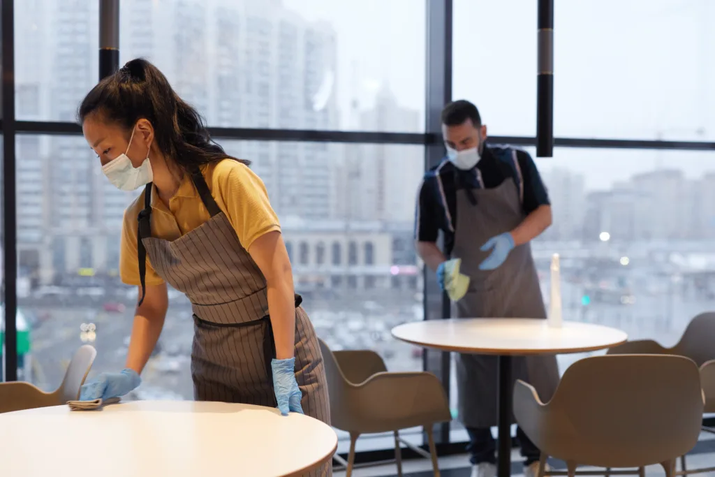 This image has an empty alt attribute; its file name is side-view-portrait-female-worker-wearing-mask-while-cleaning-tables-cafe-interior-covid-safety-concept-copy-space-1-1024x683.webp